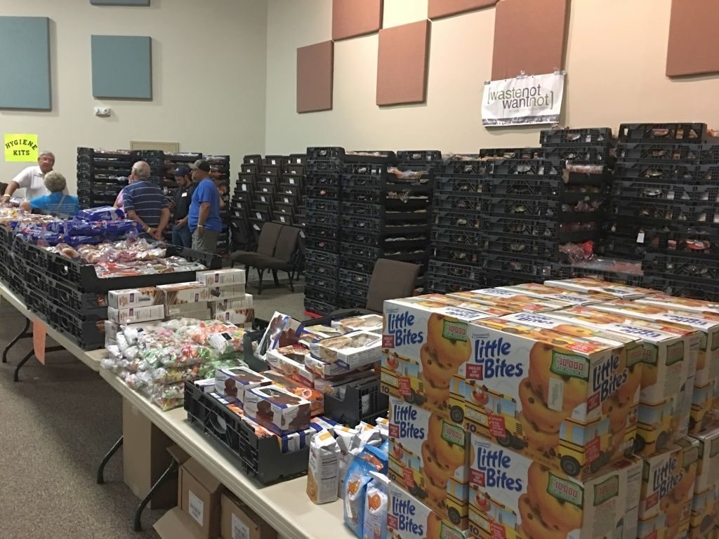 Volunteers and community partners organizing food and supplies